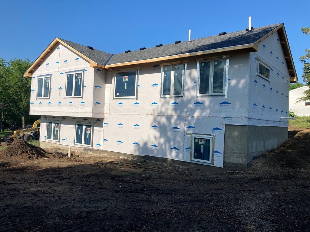 New construction home with new roof - back